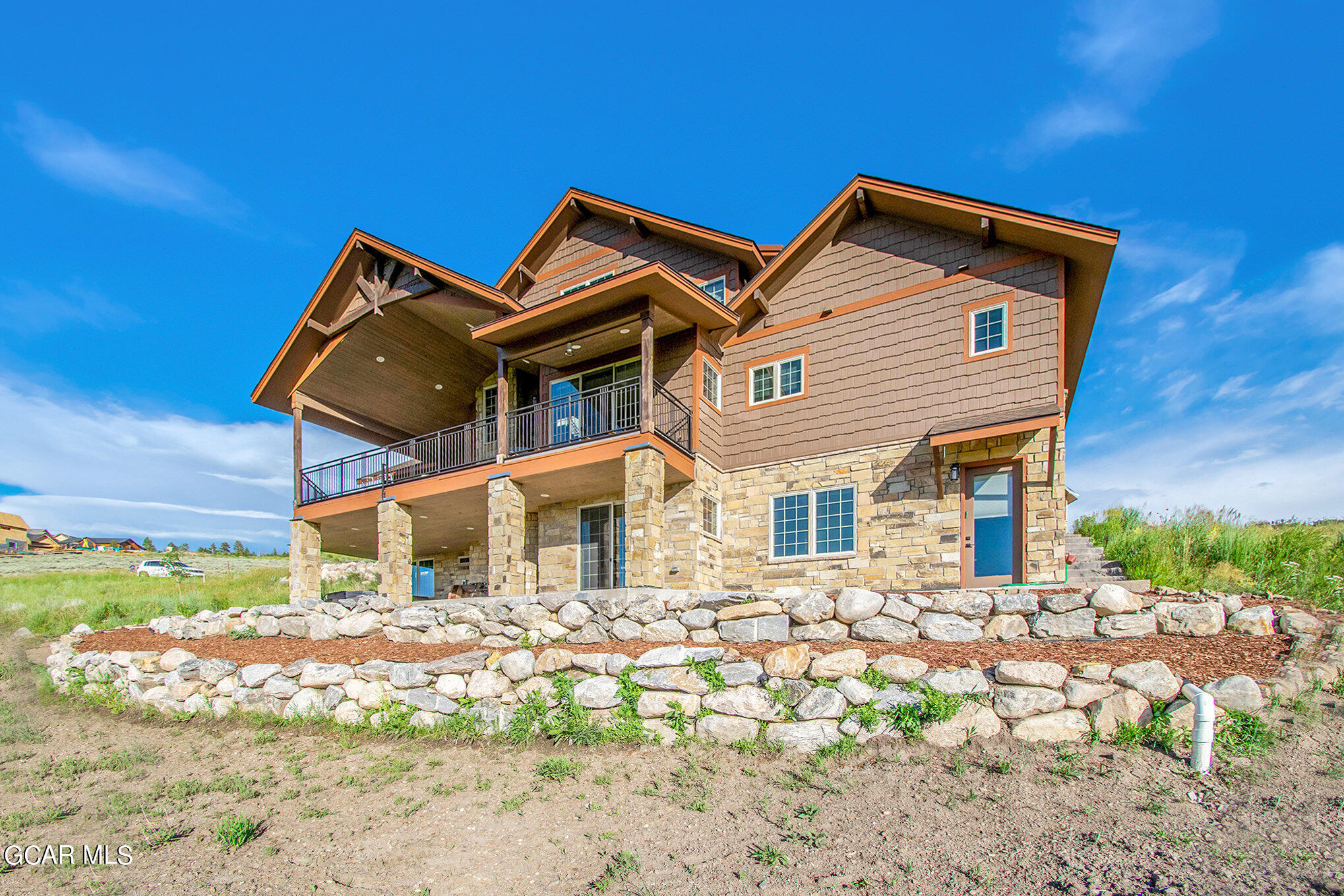 609 Lower Ranch View Drive Granby, CO 80446 - Photo 48 of 54 a front view of a house with a yard