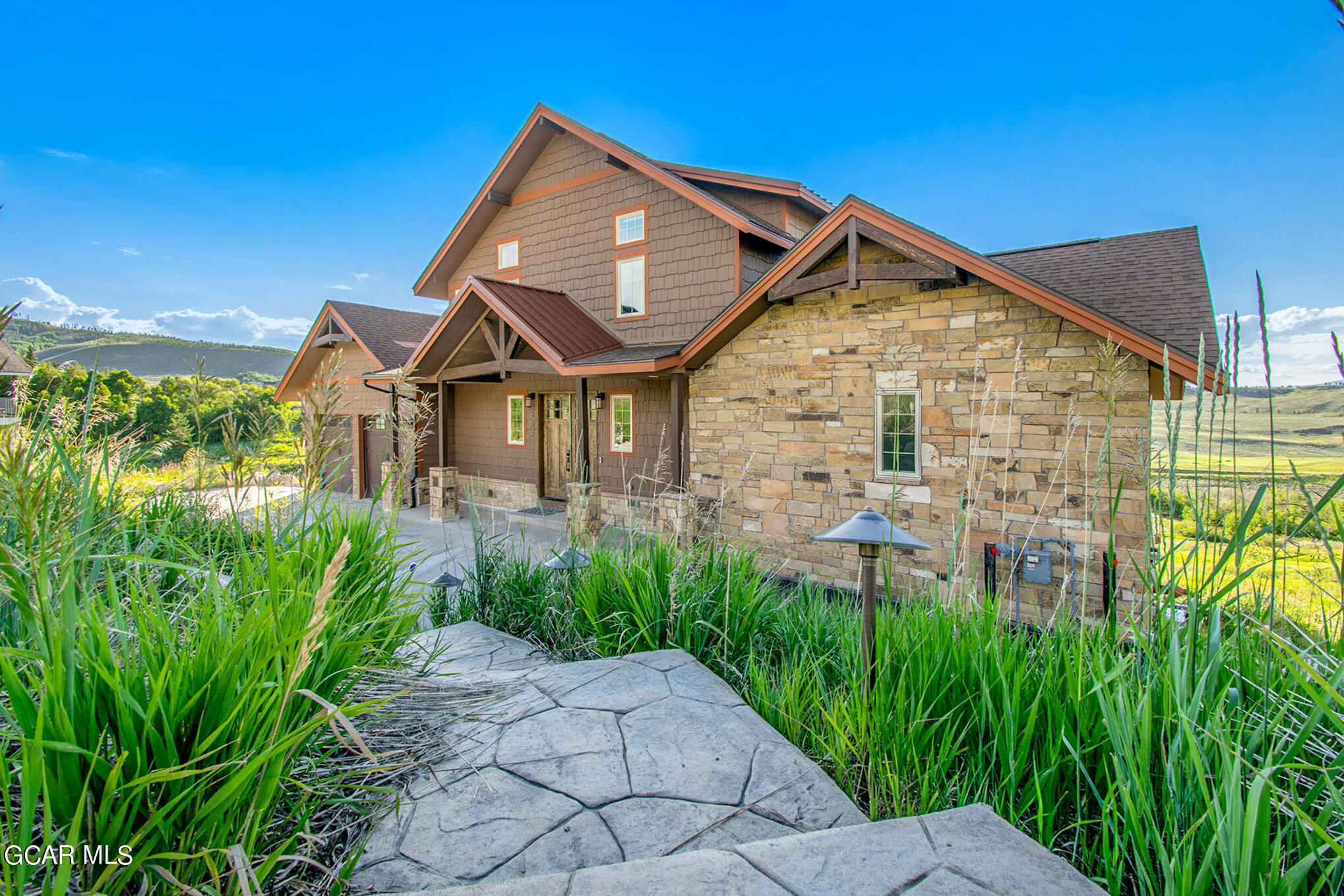 609 Lower Ranch View Drive Granby, CO 80446 - Photo 8 of 54 a front view of a house with garden