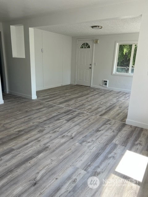 8843 3rd Avenue South Seattle, WA 98108 - Photo 11 of 39 a view of an empty room with wooden floor and a window