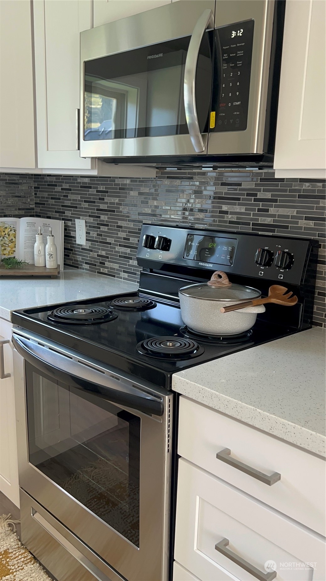 8843 3rd Avenue South Seattle, WA 98108 - Photo 23 of 39 a stove top oven sitting inside of a kitchen