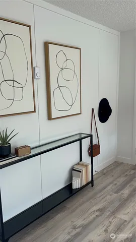 a view of an entryway with wooden floor