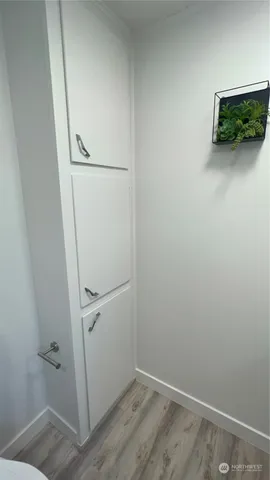 a white toilet sitting next to a bathroom sink