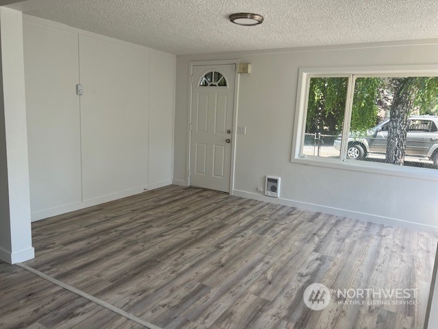 8843 3rd Avenue South Seattle, WA 98108 - Photo 6 of 39 a view of empty room with wooden floor and fan