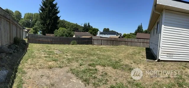 a backyard of a house with lots of green space