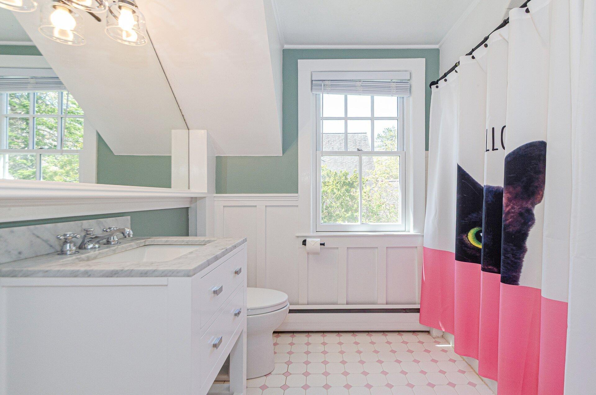 1089 Main Street Cotuit, MA 02635 - Photo 22 of 41 a bathroom with a sink a toilet and window