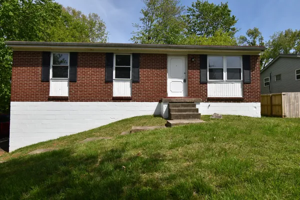 a backyard of a house with seating space