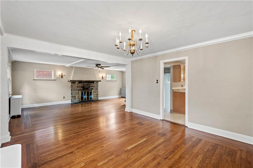 220 Cochran Road Mt. Lebanon, PA 15228 - Photo 16 of 35 a view of empty room with wooden floor and fireplace