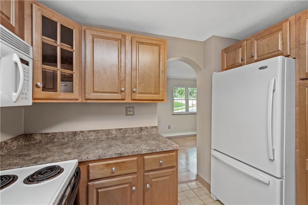 220 Cochran Road Mt. Lebanon, PA 15228 - Photo 19 of 35 a kitchen with granite countertop cabinets and refrigerator