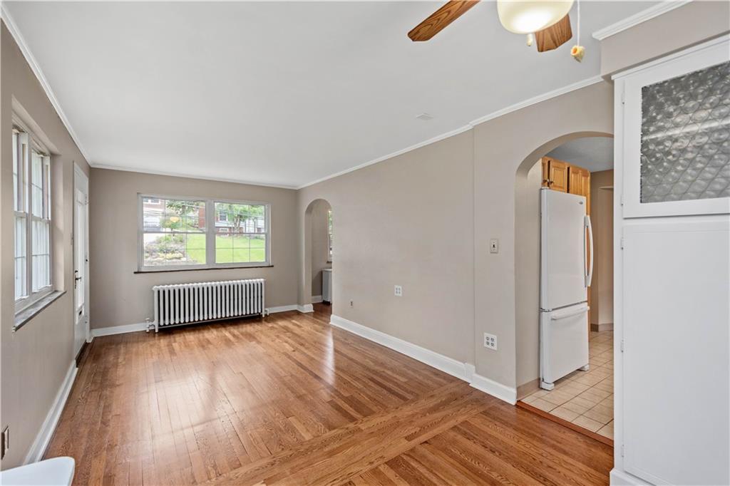220 Cochran Road Mt. Lebanon, PA 15228 - Photo 21 of 35 an empty room with windows and wooden floor