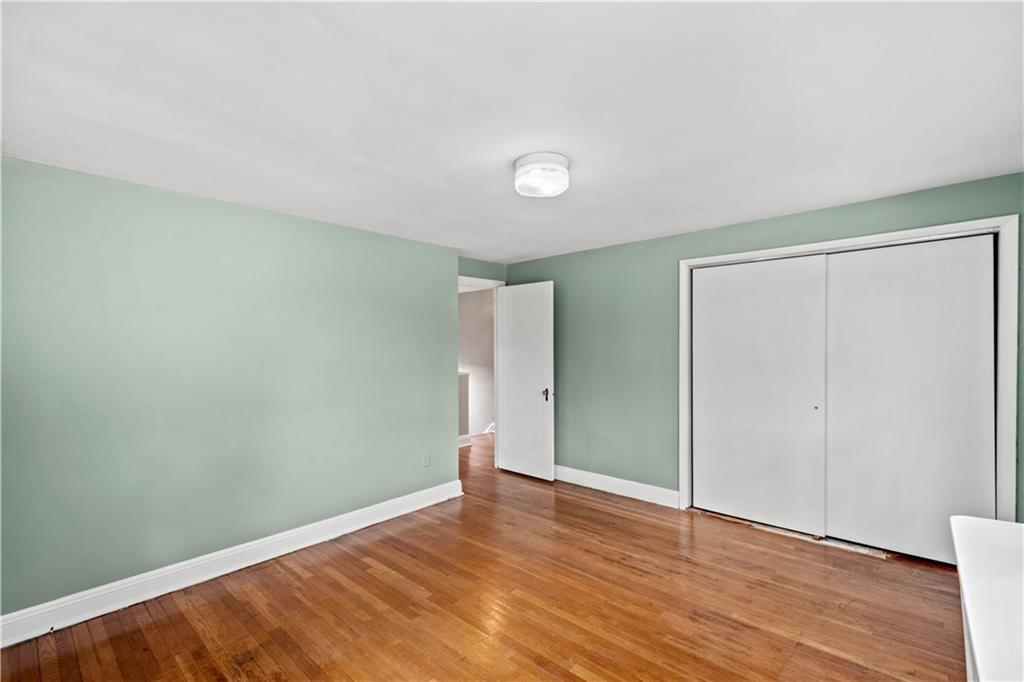 220 Cochran Road Mt. Lebanon, PA 15228 - Photo 28 of 35 an empty room with wooden floor and closet
