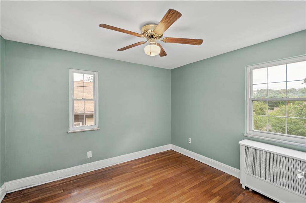 220 Cochran Road Mt. Lebanon, PA 15228 - Photo 29 of 35 a view of an empty room with wooden floor and a window