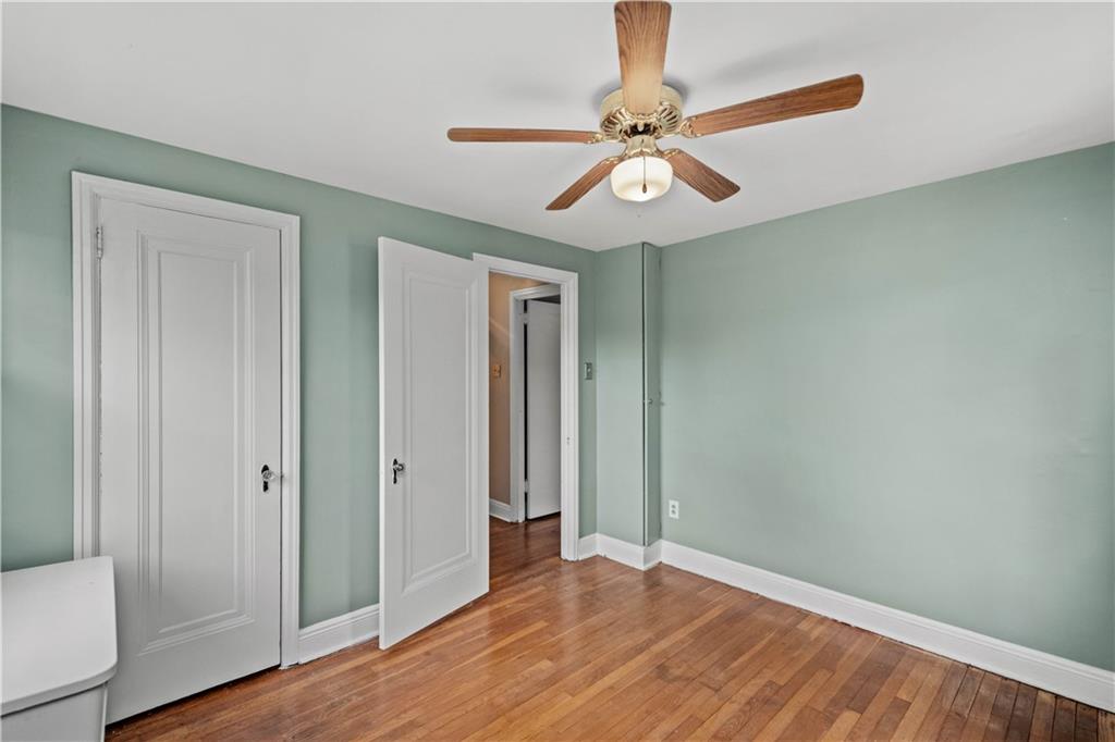 220 Cochran Road Mt. Lebanon, PA 15228 - Photo 30 of 35 an empty room with wooden floor fan and windows