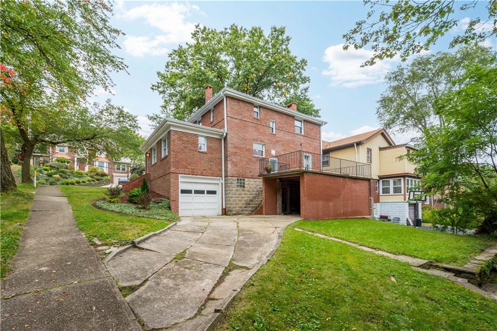 220 Cochran Road Mt. Lebanon, PA 15228 - Photo 3 of 35 a front view of a house with garden