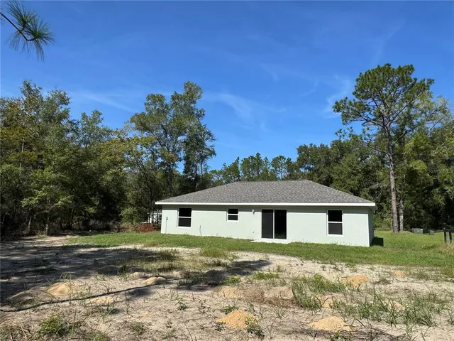 a aerial view of a house with a yard