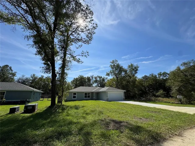 a view of a backyard with green space