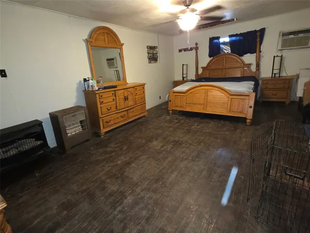 a bedroom with furniture and mirror