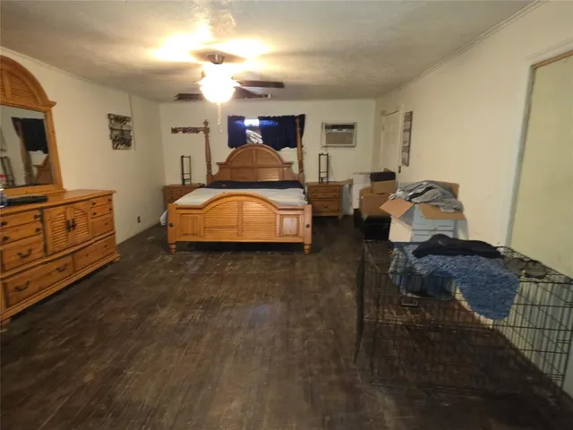 a kitchen with kitchen island granite countertop a sink a stove and cabinets