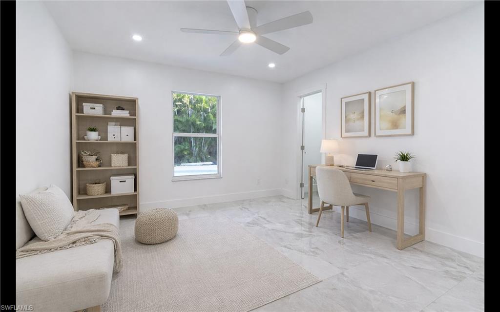 5431 23rd Avenue Southwest Naples, FL 34116 - Photo 18 of 40 a living room with furniture and a window