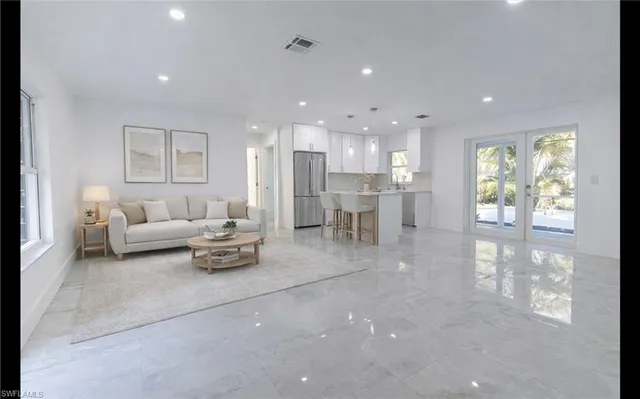 a living room with furniture and a table