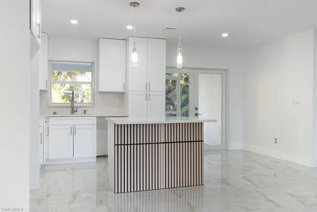 a view of kitchen with windows