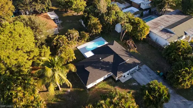 an aerial view of a house with a yard and garden