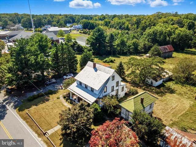 an aerial view of residential houses with outdoor space