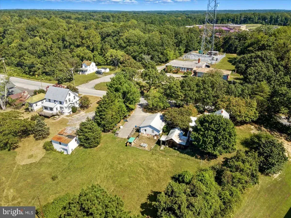 a view of a swimming pool with a table and chairs