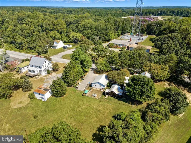 a view of a swimming pool with a table and chairs