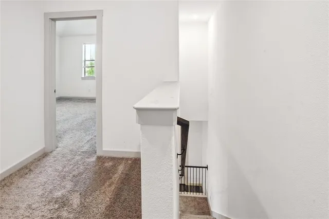 a view of hallway with stairs