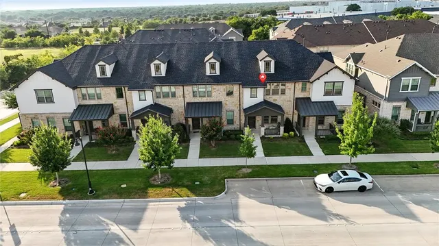 an aerial view of a house with a garden