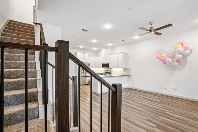 a view of entryway and kitchen