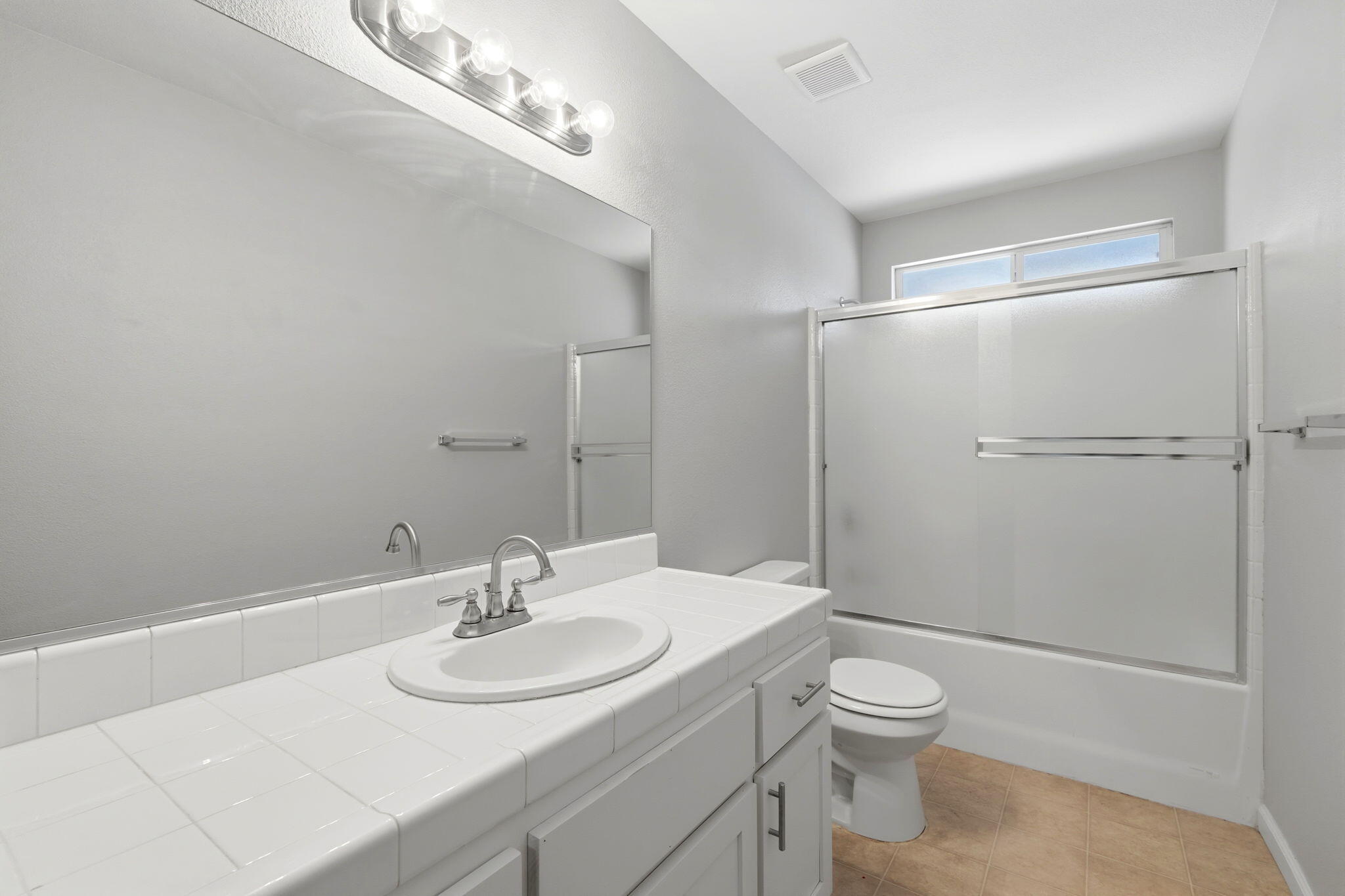 481 Katelyn Court Exeter, CA 93221 - Photo 14 of 33 a bathroom with a sink toilet and shower