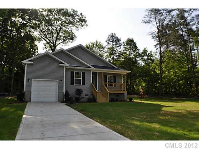 3968 Kiser Island Road, Unit 2 Terrell, NC 28682 - Photo 1 of 16 a front view of house with yard and green space