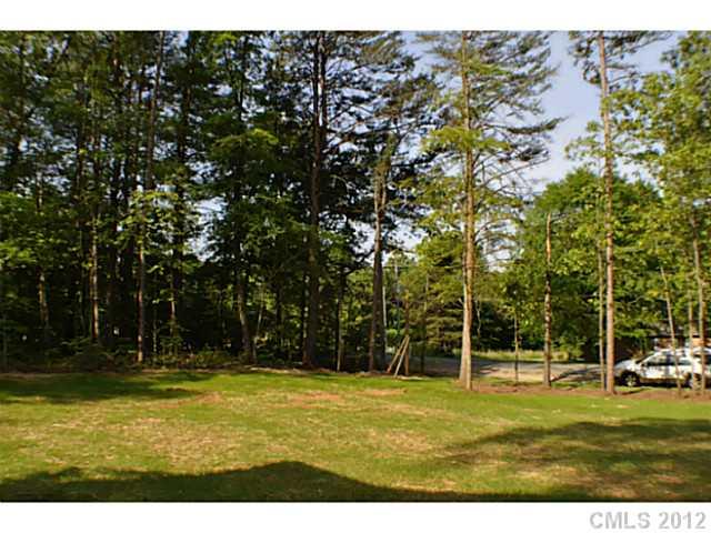 3968 Kiser Island Road, Unit 2 Terrell, NC 28682 - Photo 2 of 16 a view of swimming pool with lawn chairs and large trees