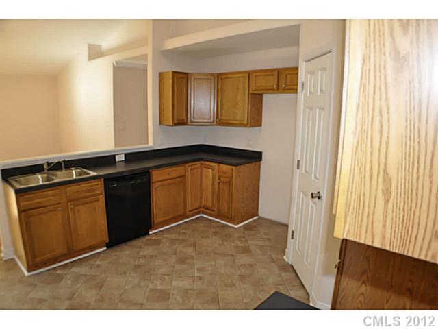 3968 Kiser Island Road, Unit 2 Terrell, NC 28682 - Photo 11 of 16 a kitchen with a sink and a refrigerator