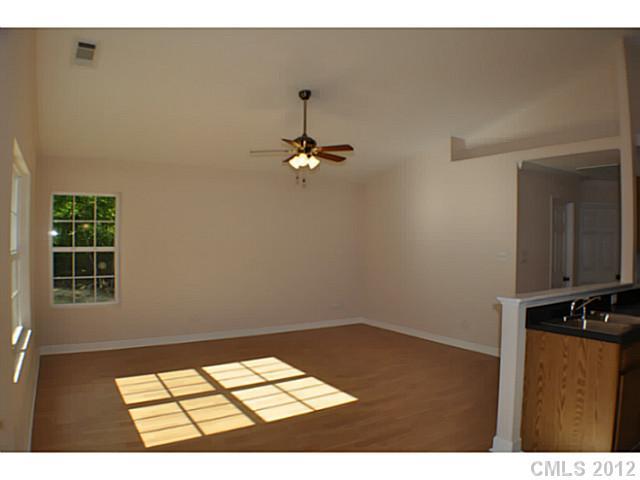 3968 Kiser Island Road, Unit 2 Terrell, NC 28682 - Photo 7 of 16 a view of a room with wooden floor and windows