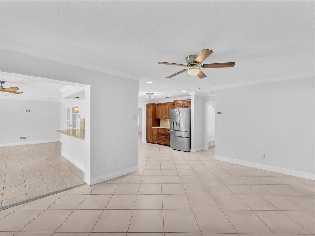 11762 Northwest 26th Court Coral Springs, FL 33065 - Photo 18 of 37 a view of an empty room with a ceiling fan