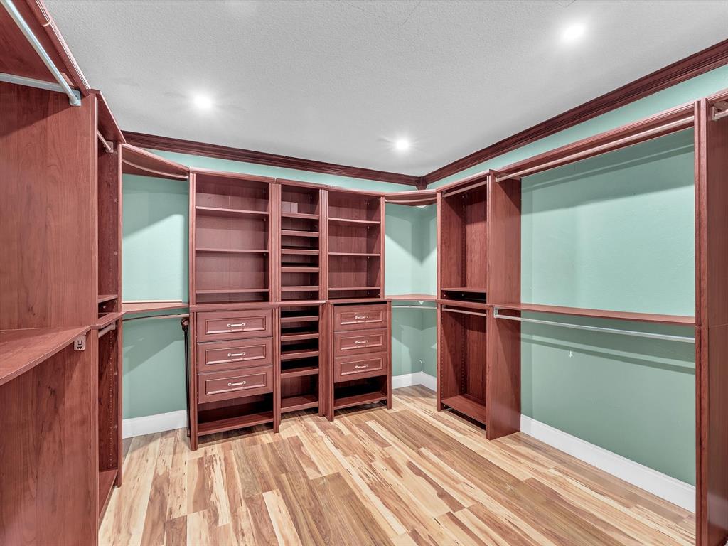 11762 Northwest 26th Court Coral Springs, FL 33065 - Photo 25 of 37 a view of walk in closet with empty racks