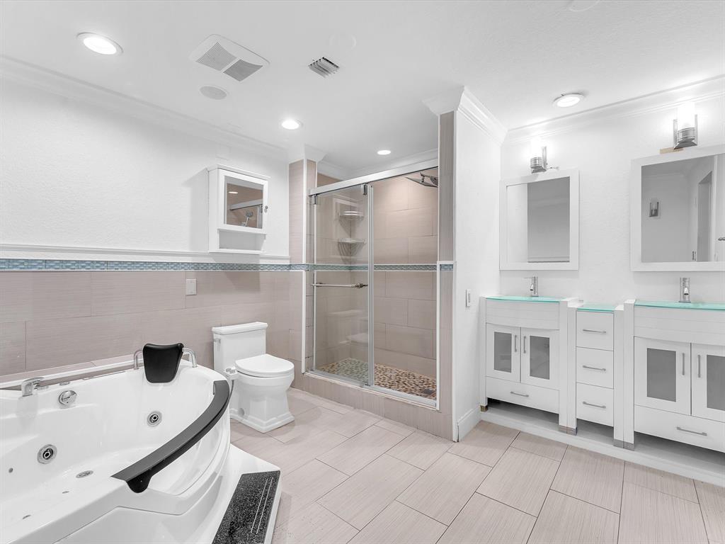 11762 Northwest 26th Court Coral Springs, FL 33065 - Photo 26 of 37 a bathroom with a bathtub shower sink and toilet