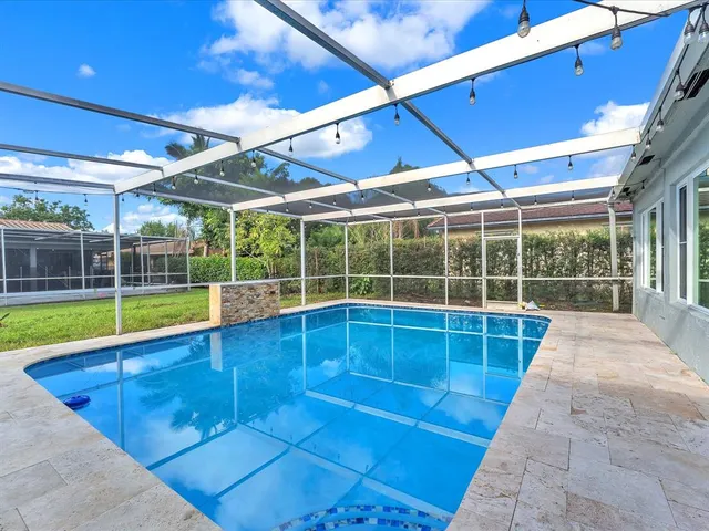 a view of a swimming pool with a porch