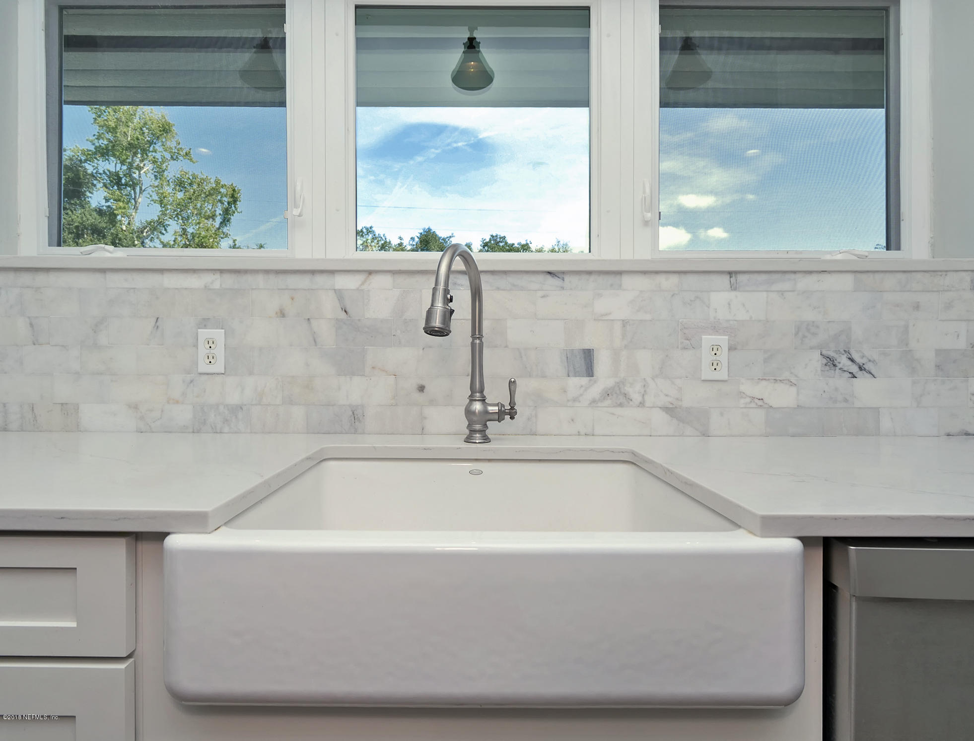 974 Waterman Road South Jacksonville, FL 32207 - Photo 11 of 43 a white bath tub sitting next to a window