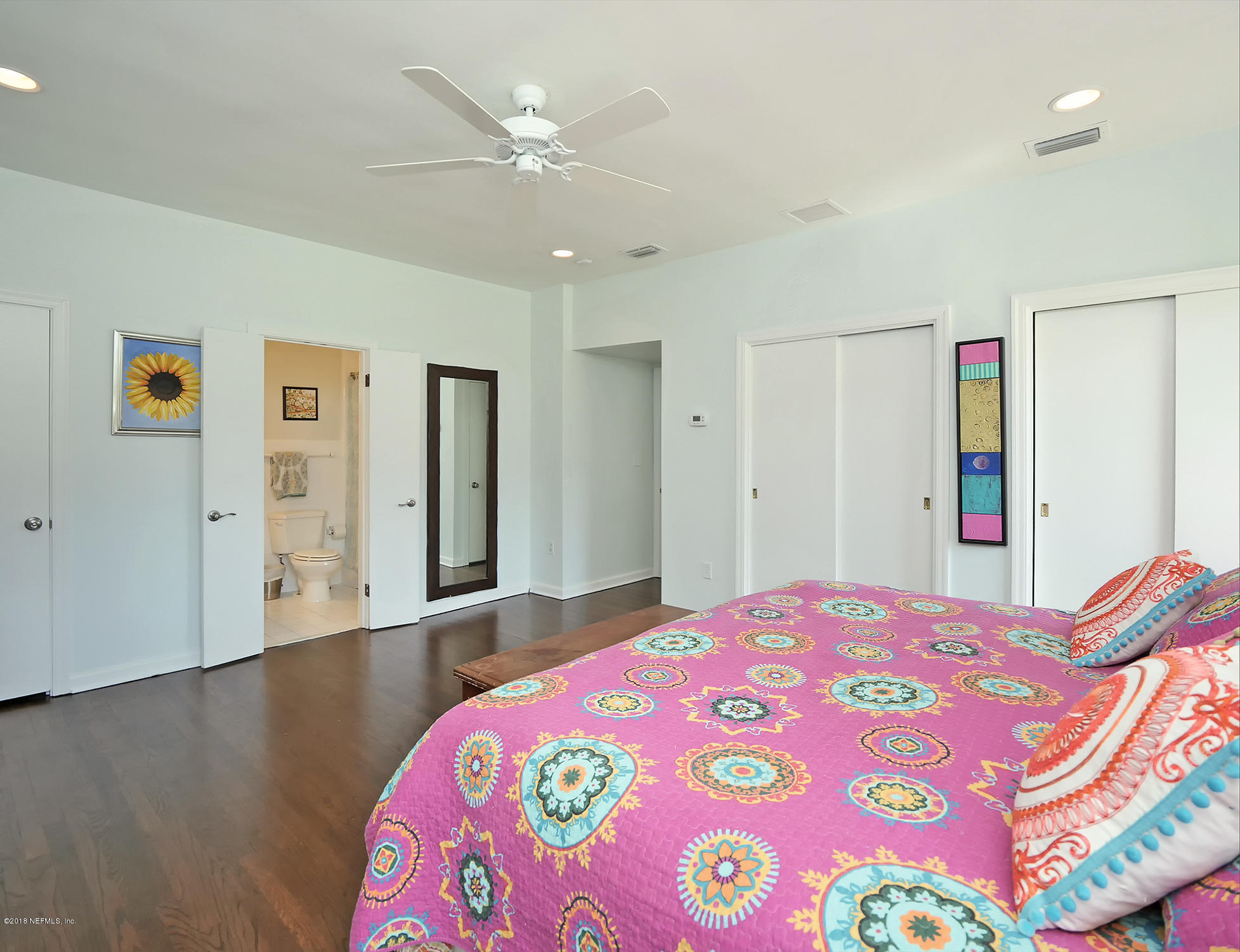 974 Waterman Road South Jacksonville, FL 32207 - Photo 33 of 43 a bedroom with a bed and a chandelier