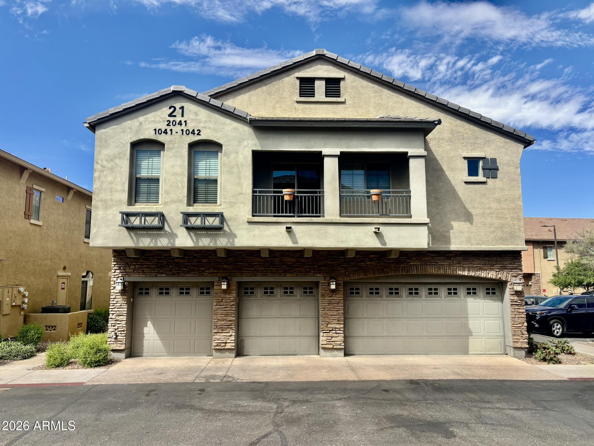 a view of a house with large windows