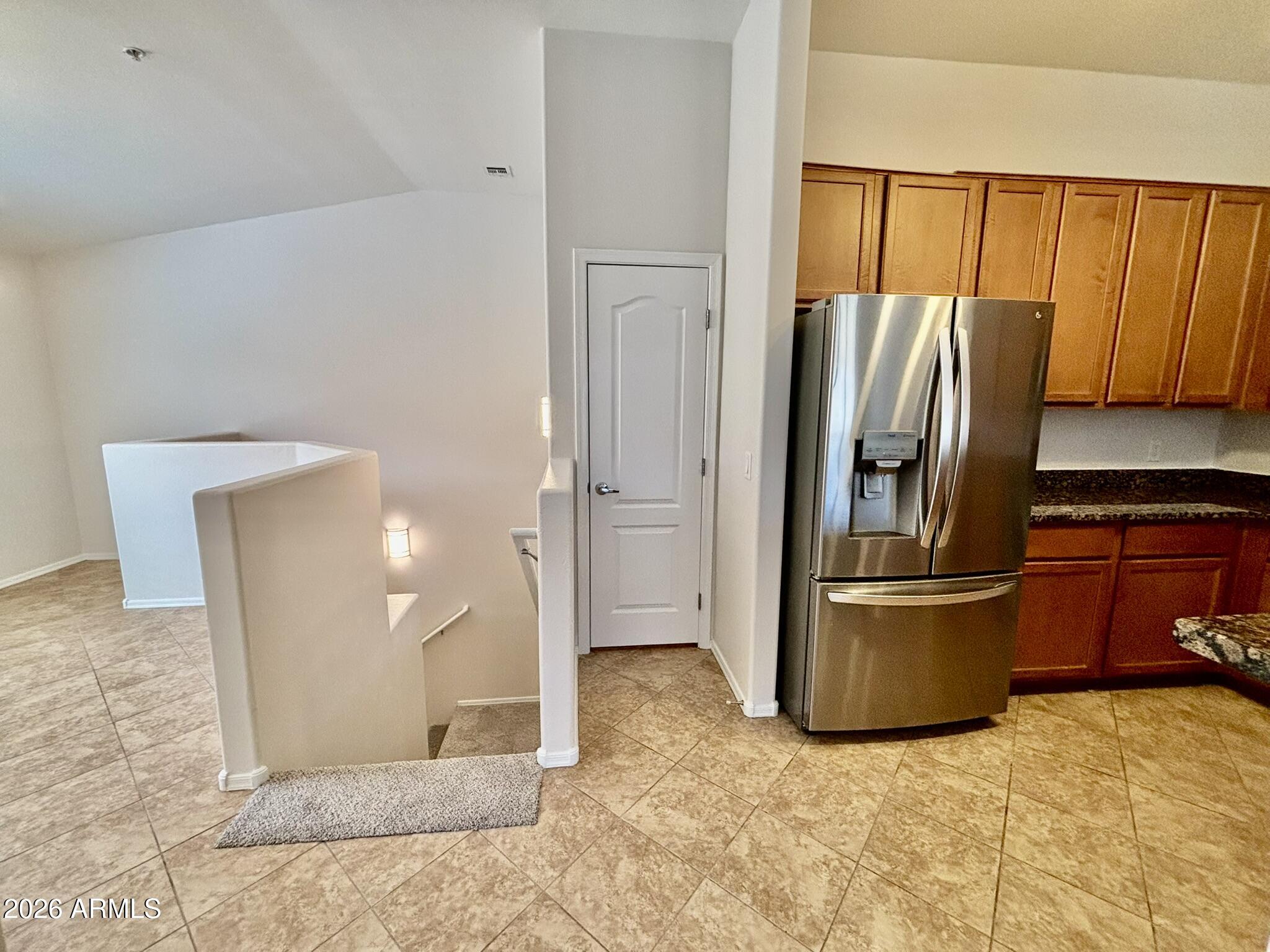 1350 South Greenfield Road, Unit 2041 Mesa, AZ 85206 - Photo 12 of 33 a view of a refrigerator in kitchen and a window