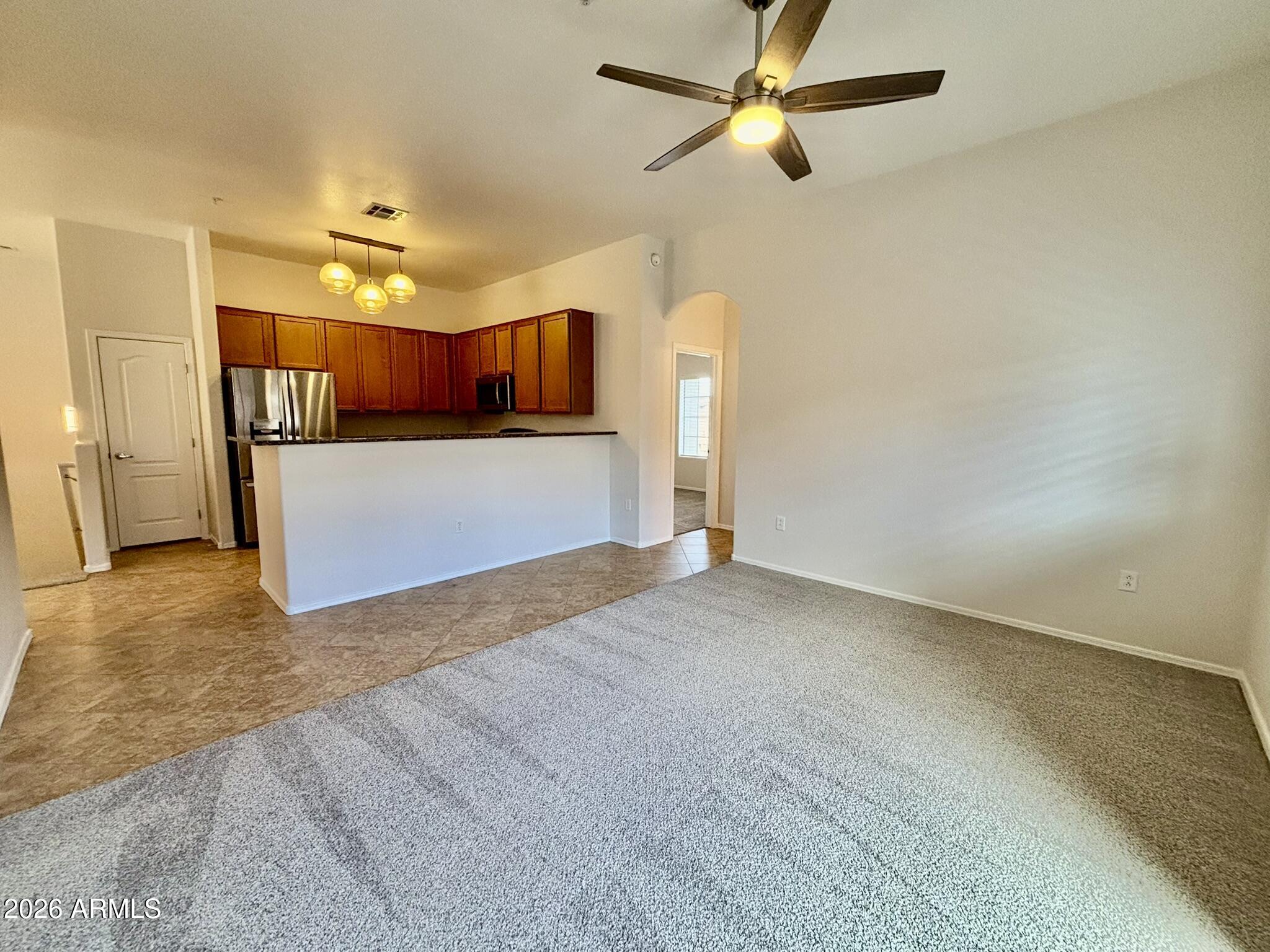 1350 South Greenfield Road, Unit 2041 Mesa, AZ 85206 - Photo 16 of 33 a view of a kitchen with a dishwasher and a refrigerator
