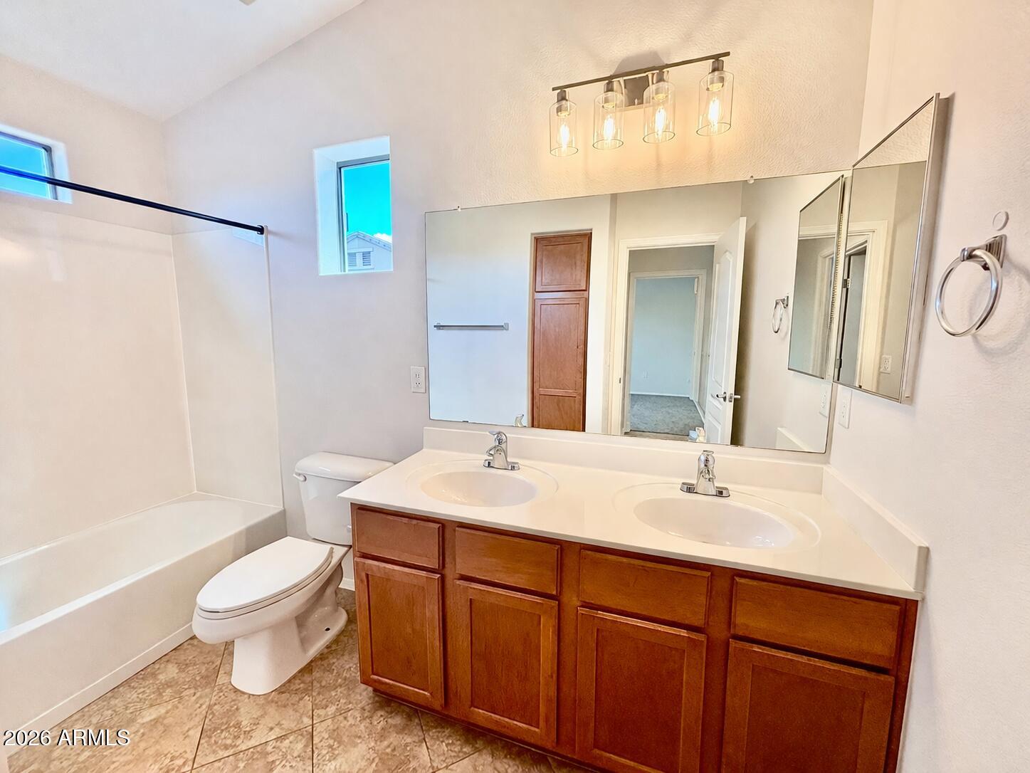 1350 South Greenfield Road, Unit 2041 Mesa, AZ 85206 - Photo 25 of 33 a bathroom with a sink toilet a mirror and shower