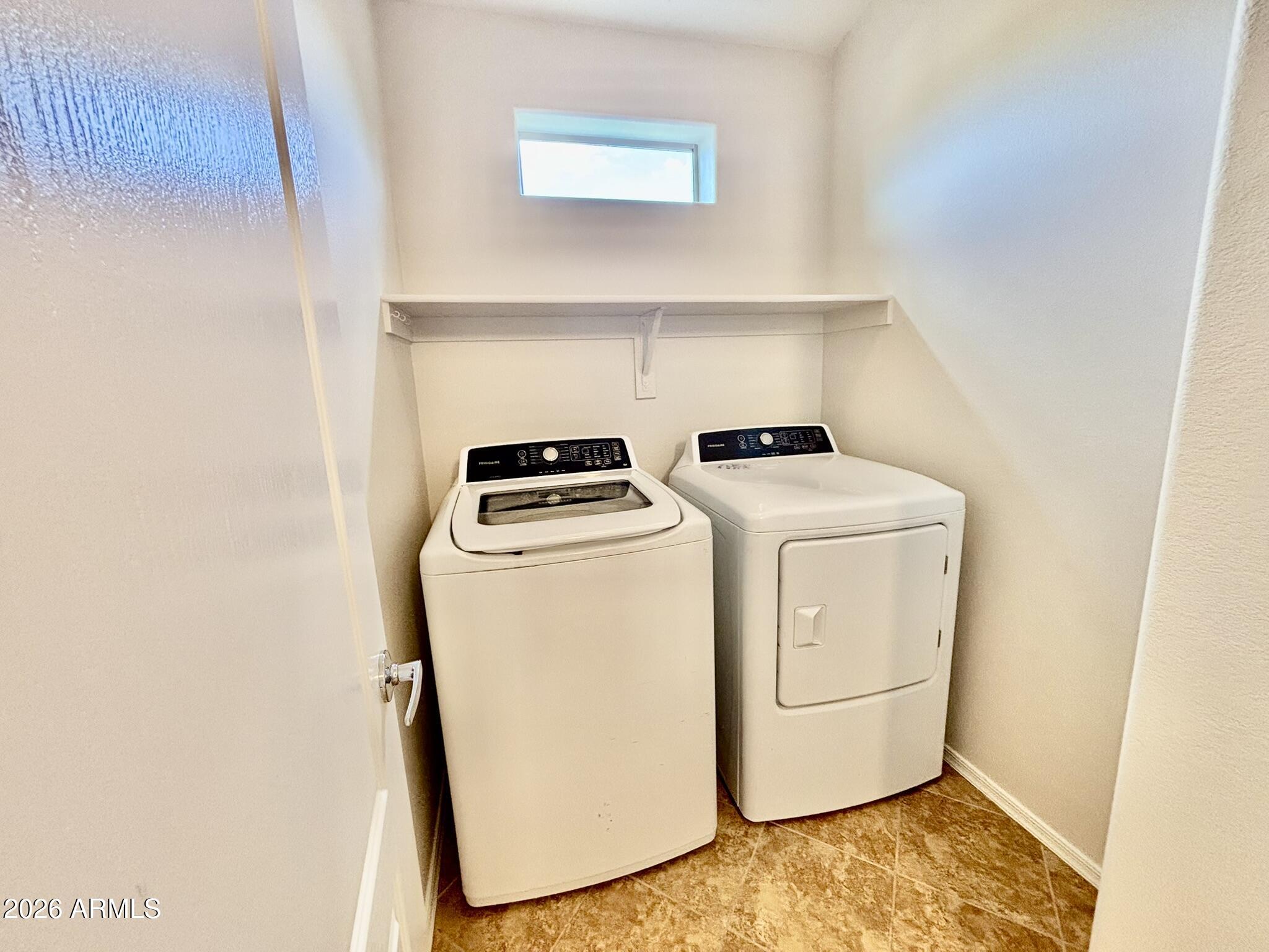 1350 South Greenfield Road, Unit 2041 Mesa, AZ 85206 - Photo 26 of 33 a utility room with dryer and washer