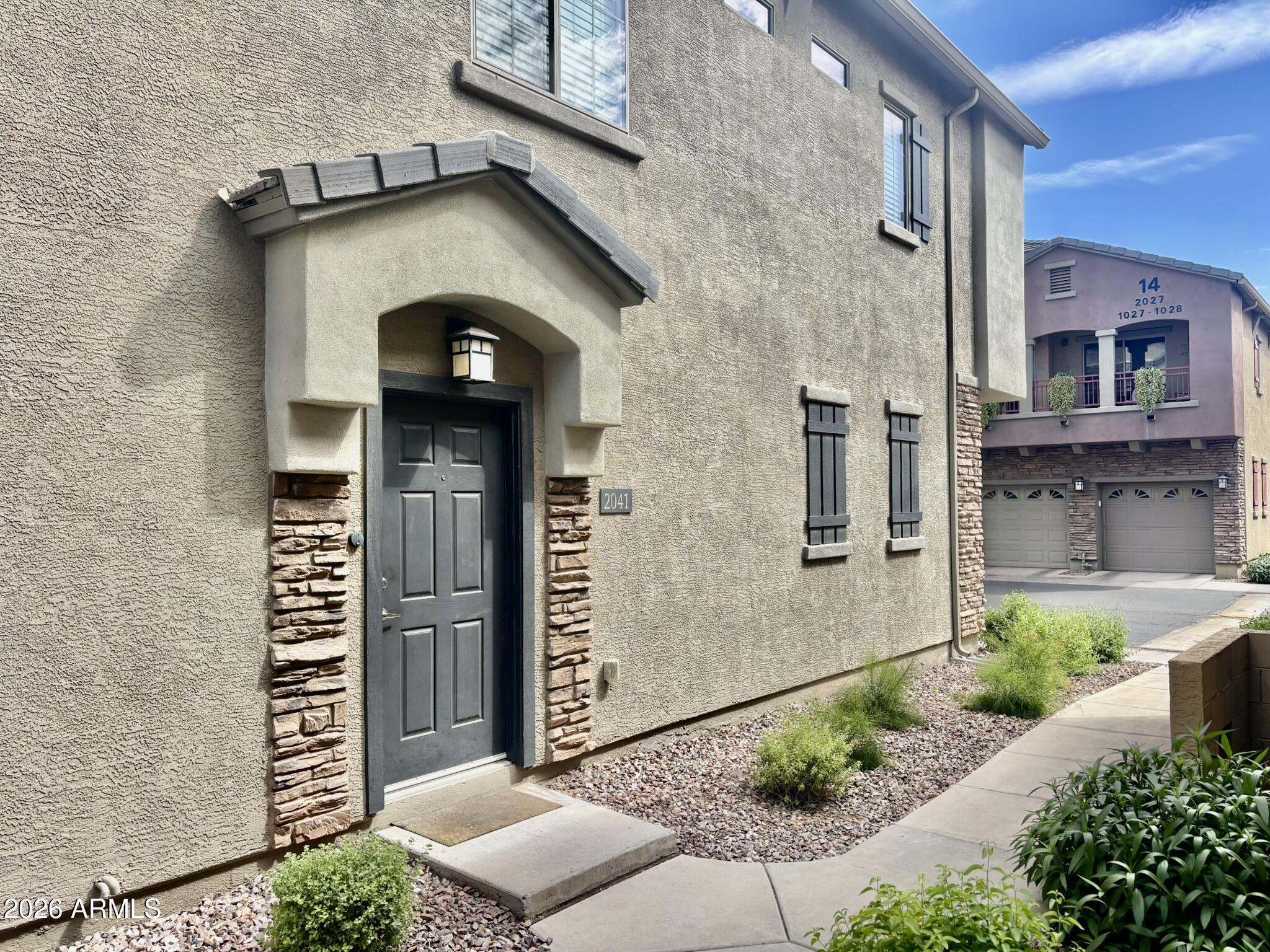 1350 South Greenfield Road, Unit 2041 Mesa, AZ 85206 - Photo 3 of 33 a front view of a house with garage
