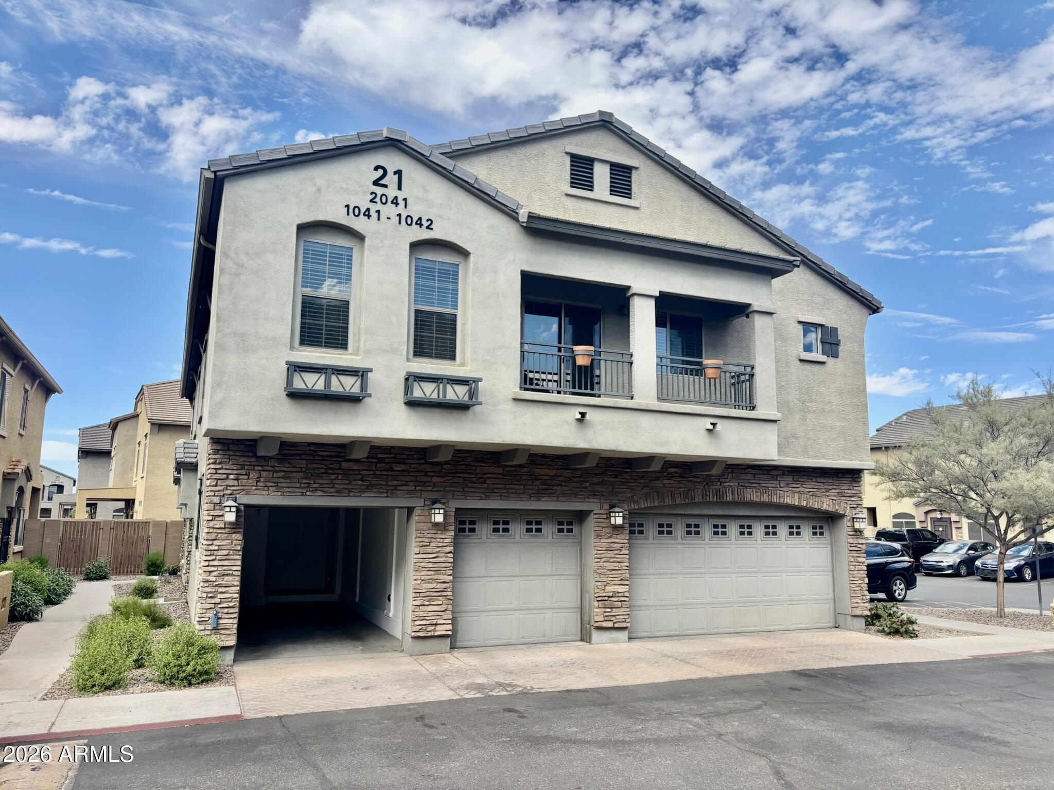 1350 South Greenfield Road, Unit 2041 Mesa, AZ 85206 - Photo 33 of 33 a front view of a house with a garage