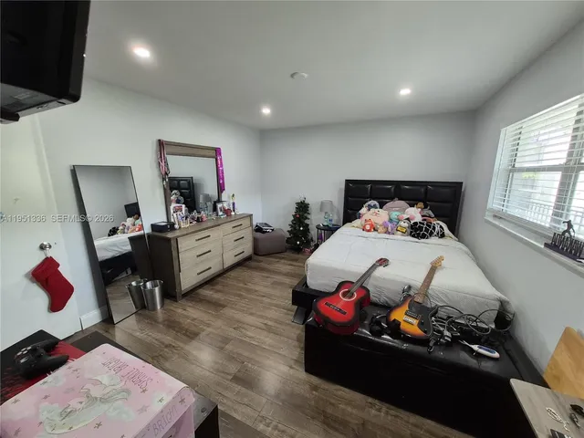 a bed room with a bed and a tv